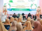 Ketua-DWP-Tanah-Bumbu-Siti-Masitah-Eryanto-Rais-memberikan-sambutan-dalam-Peringatan-Maulid-Nabi-Muhammad-SAW-1448-H-1024x683